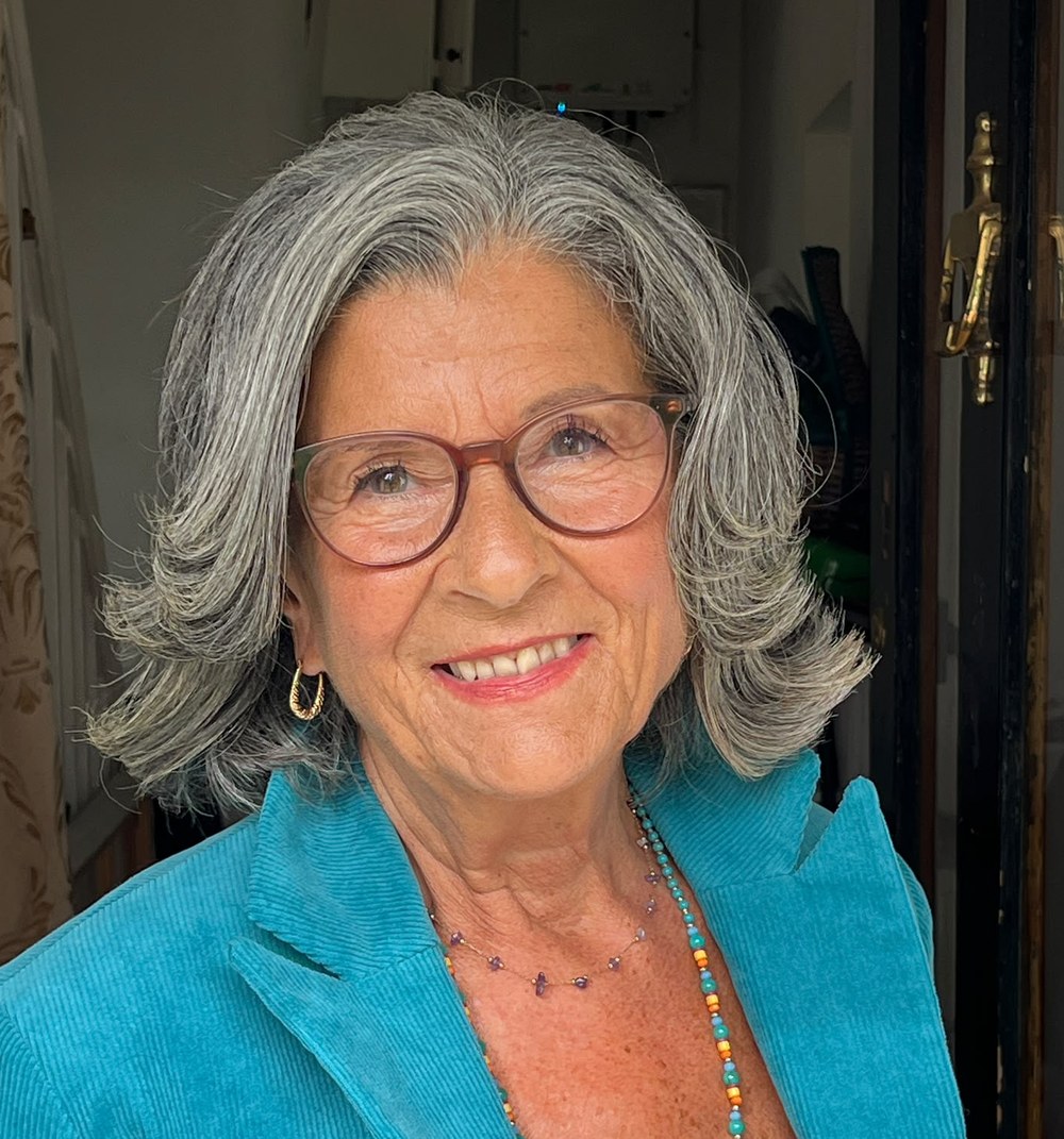Sheela Hagan smiling in a turquoise jacket